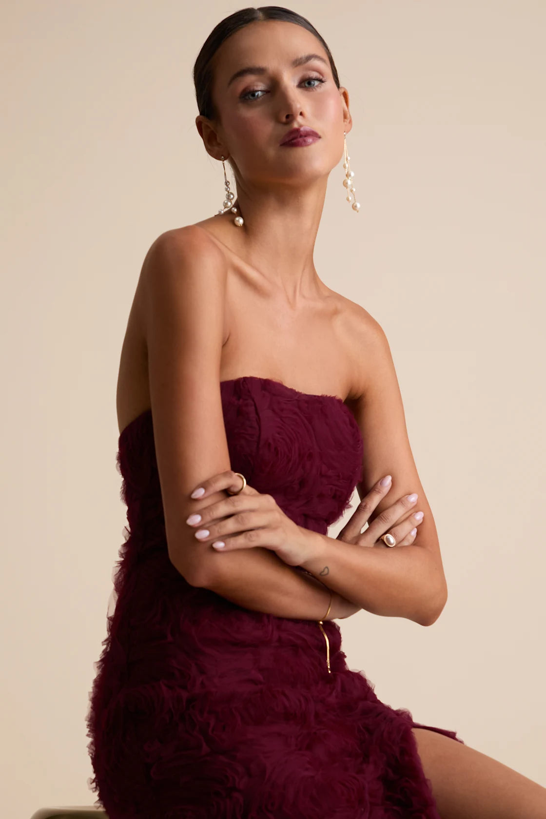 You'll instantly become the definition of romance when you step into this sleek satin dress, featuring a slip-style silhouette that gracefully skims the figure. The midi design features wide pleated straps that support a plunging bodice with lightly